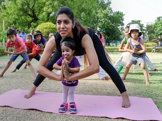 World's shortest woman Jyoti Amge (25) and Yoga exponent Dhanshri Lekurwale practice yoga in Nagpur